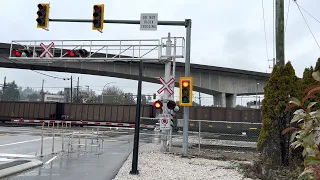 CP freight train passing the railroad crossing at Braid St, New Westminster, BC