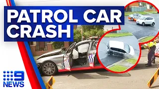 Police officer injured after patrol car slams into another vehicle | 9 News Australia