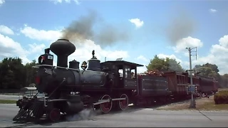 Steam Train Passing Through Crossing