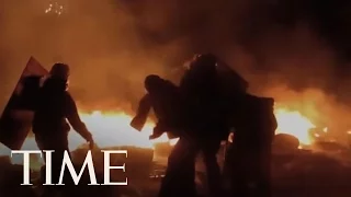 A Protestor Throws A Molotov Cocktail Towards Riot Police During Clashes In Kiev | TIME