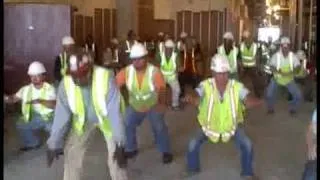 Construction workers stretch