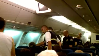 Guy getting arrested on flight from LAX to IAD