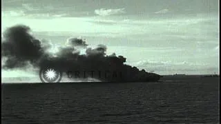 USS Ommaney Bay (CVE-79) burns at Sulu sea in Philippines following kamikaze atta...HD Stock Footage