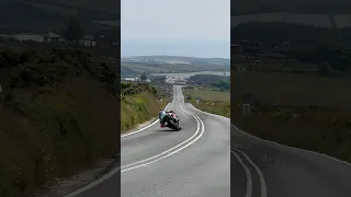 Isle of Man Senior TT winner Peter Hickman speeds down towards to Creg!