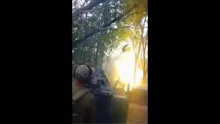 Ukraine gunners cut through brush firing on enemy targets