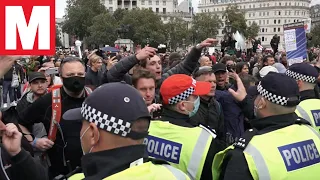 Covid-19 anti-lockdown protesters clash with police in London's Trafalgar Square