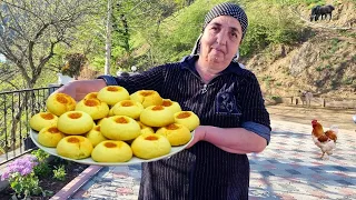 GRANDMOTHER BAKED DELICIOUS SWEET BREAD IN THE VILLAGE