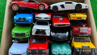 Box full of model CARS, Pagani, Lamborghini, BMW, Rolls Royce, Lexus570, slr, Urus.