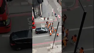 Man shoves Just Stop Oil activist to the ground during protest in London