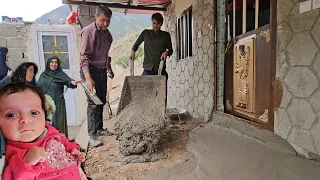 Babak's uncle cements the terrace of the village house and his wife cooks traditional village food