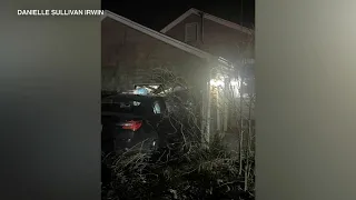 Stolen car hits house, 2 cars before slamming into suburban garage