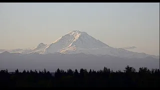 The sun rises over Mount Rainier