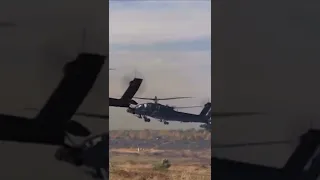 AH-64 firing Hydra70 rockets from inside and outside