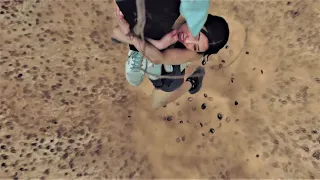 The girl hangs on a tree to hide from man-eating insects!