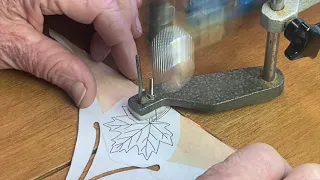 Hegner scroll saw cutting out a small maple leaf