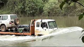 A Tow Truck deep water crossing in crocodile infested waters