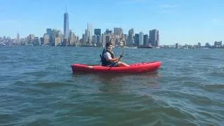 Justin kayaks around the Statue of Liberty