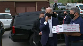 Joe Biden HECKLED as he delivers pizzas to first responders