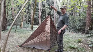 Tarp setup with a floor and door.