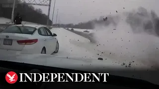 Truck smashes into police car narrowly missing officer on icy Ohio highway