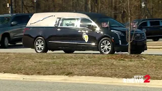 Hearse carrying Sgt. Nix leaves funeral home