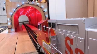 Big Model Trains Through A Red Tunnel