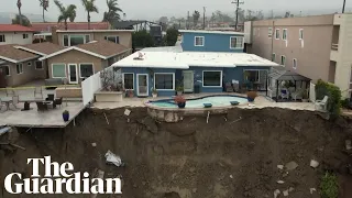 House left perched on cliff edge after landslide in southern California