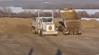 QUAD DUMPING THE LOAD