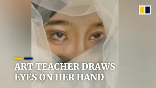 Art teacher in China draws realistic facial features on her hand