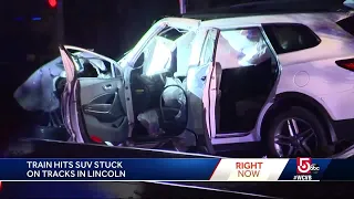 Woman escapes injury as SUV demolished by train