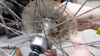 Adjusting a cup & cone type bearing (rear wheel)