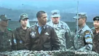 US President Barack Obama peers across South Korea's border