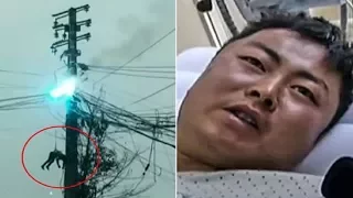 Repair man left dangling from burning electricity pylon after high-voltage wires suddenly burst