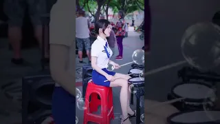 beautiful girl playing drums