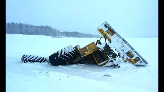 бездорожье зимника проволился трактор к701 под лед