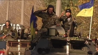 Ukrainian troops receive warm homecoming after serving three months in eastern Ukraine