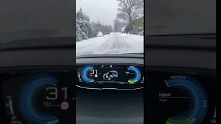 Driving through winter streets in Peugeot 3008 Hybrid4