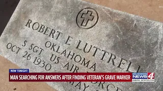 Man searching for answers after finding headstone