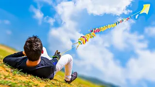 Flying 100 Kites At Once - Longest Kite Train