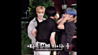 Wooyoung using Hongjoong's chest to burst ballons