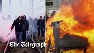 French protesters block rail tracks and start fires over pensions reform