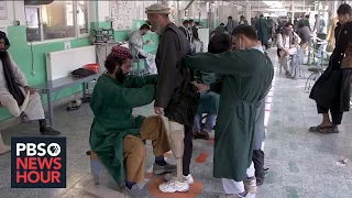 Aid groups struggle to continue humanitarian aid for starving, injured Afghans