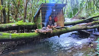 Camping in heavy rain alone. making a simple bamboo shelter
