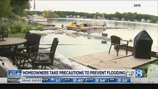 Homeowners take precautions to prevent flooding