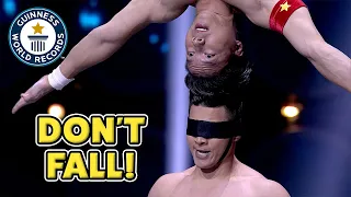 Brothers balance on each other's head! - Guinness World Records