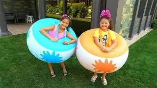 Masal and Öykü playing inflatable balls - fun video
