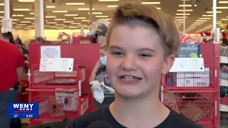 Two children find the perfect Christmas gifts during "Shop with a Cop" event