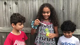 Kids blowing bubbles for the first time