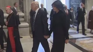 Melania Trump Seen Holding President's Hand After Apparently Swatting It Away