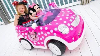 Stacy and the new children's car ride on with a minnie mouse